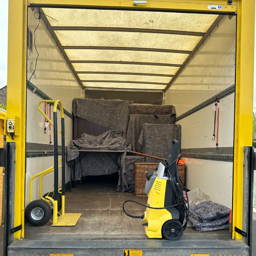 Inside the van with moving blankets, trolley and equipment ready for a removal