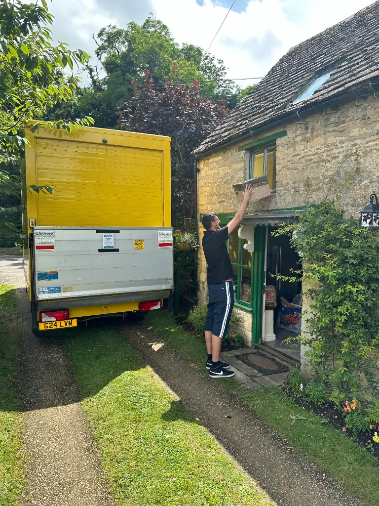 Removals Leighton Buzzard van reversed up to a stone cottage for a removal